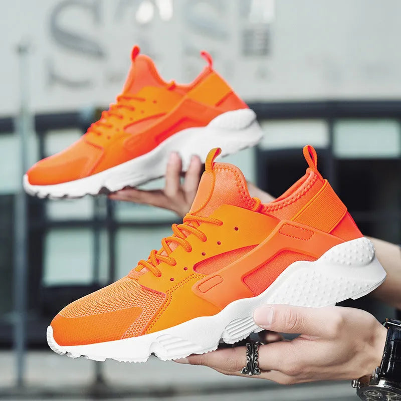 Men's low top casual shoes with mesh upper, cross shoulder straps, and round toe in fluorescent colour options