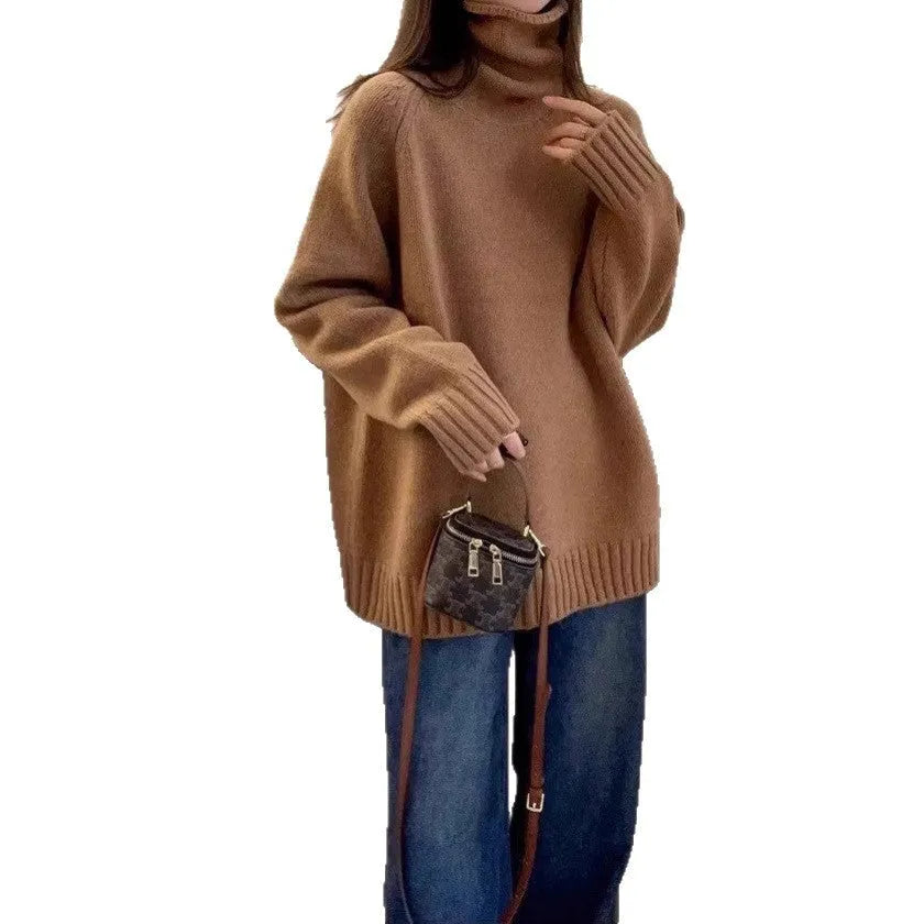 A woman's loose-fitting thick turtleneck sweater in a solid colour with a 3D textured pattern.