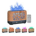 Square snowflake wood grain aromatherapy diffuser showing colourful flame effect mist and remote control on a desktop.