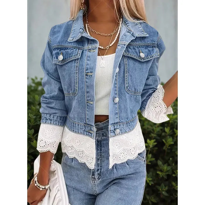 Blue women's denim jacket with lace stitching detail on front, long sleeves, shown on hanger
