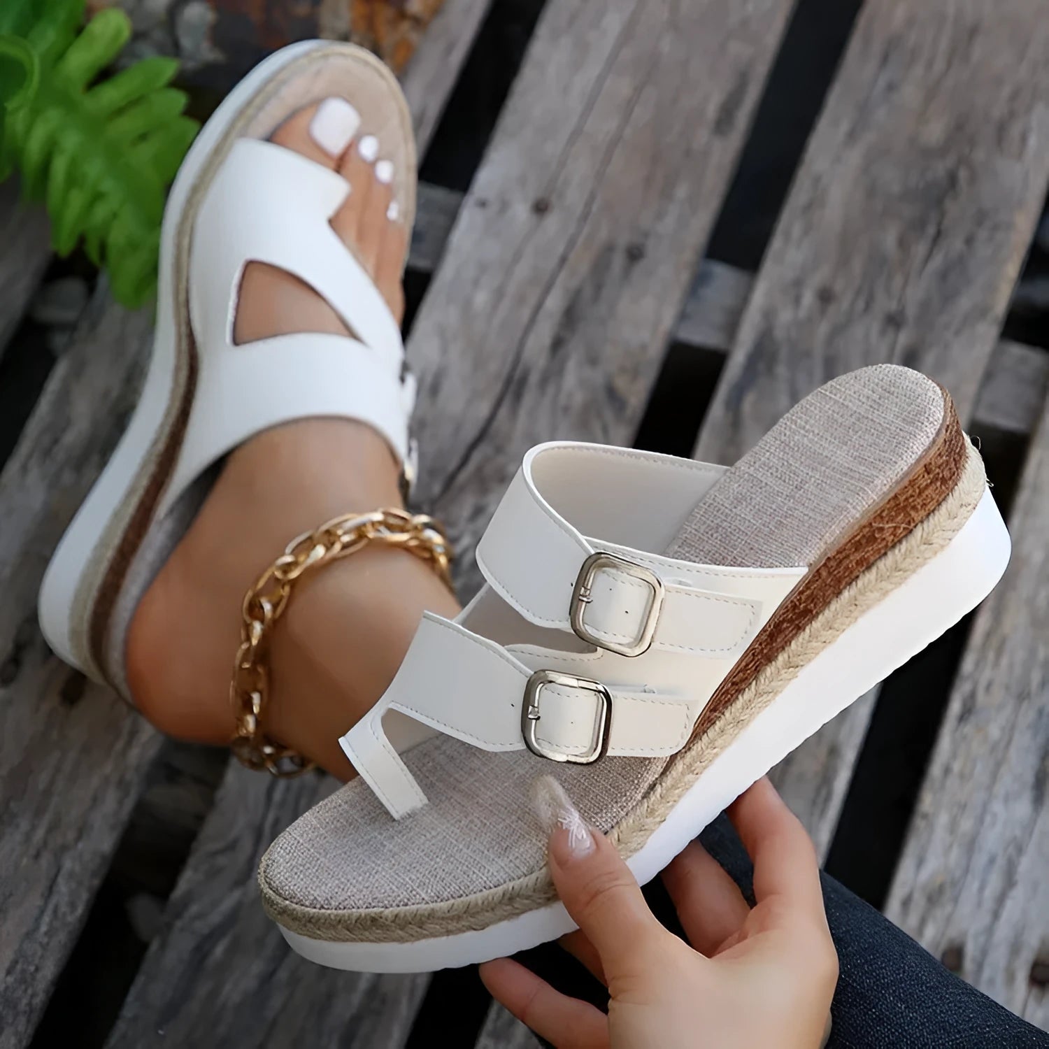 White patent leather wedge sandals with peep toe woven design and finger fit construction