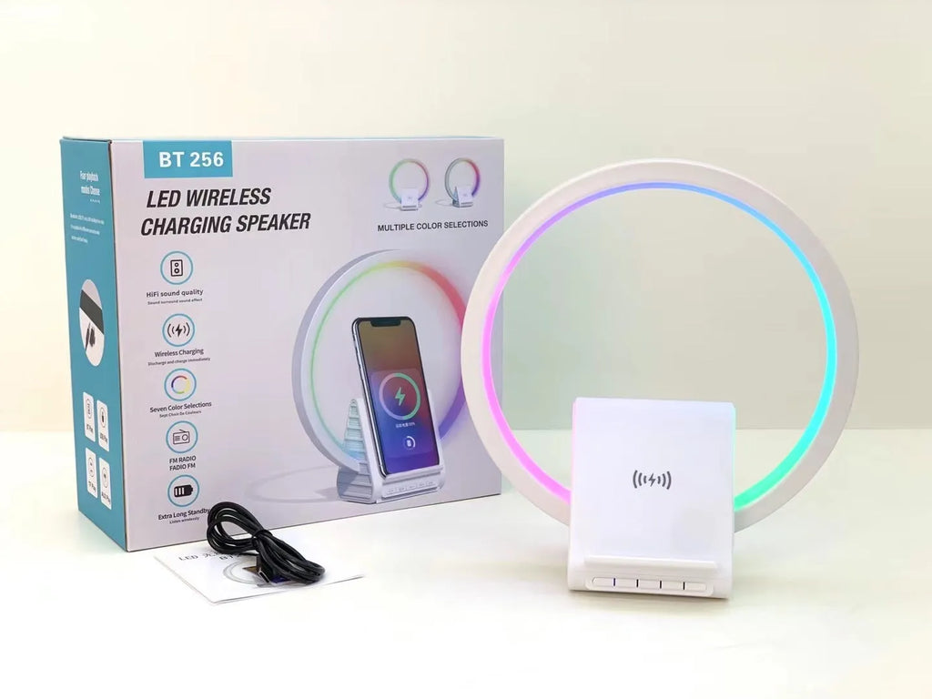 White Bluetooth speaker with wireless charging pad and ambient lighting, 225mm by 200mm dimensions