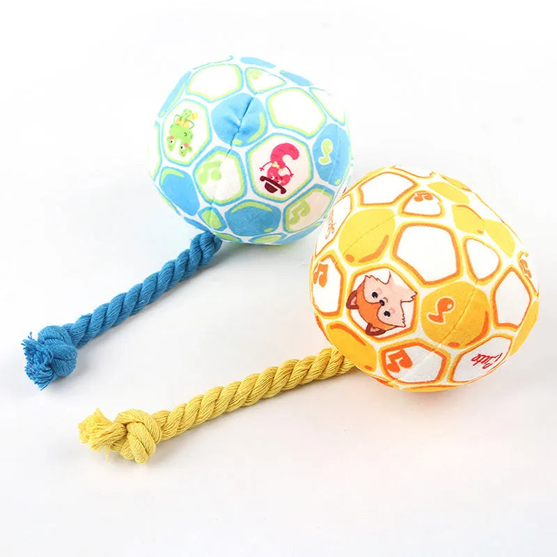 Blue and yellow cartoon elastic football dog toy made from cotton rope for tug of war and chewing.