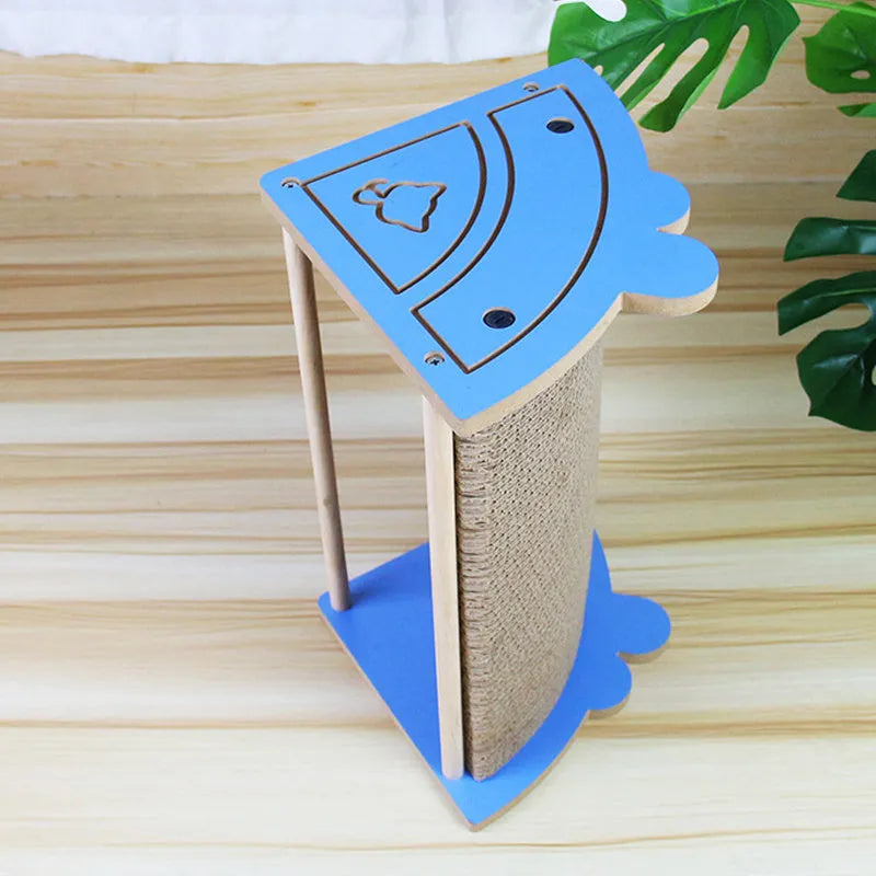 Grey cardboard cat scratching pad in a room corner with a hanging ball attached.