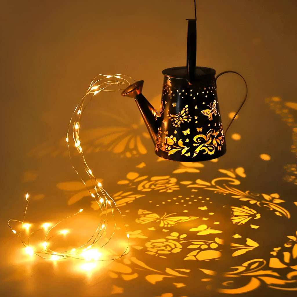 Tapered iron solar garden lamp with butterfly pattern emitting warm white light in a courtyard setting