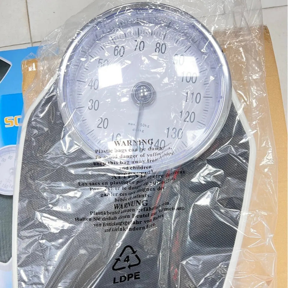 Black mechanical bathroom scale with large analogue dial on 47x35cm platform.