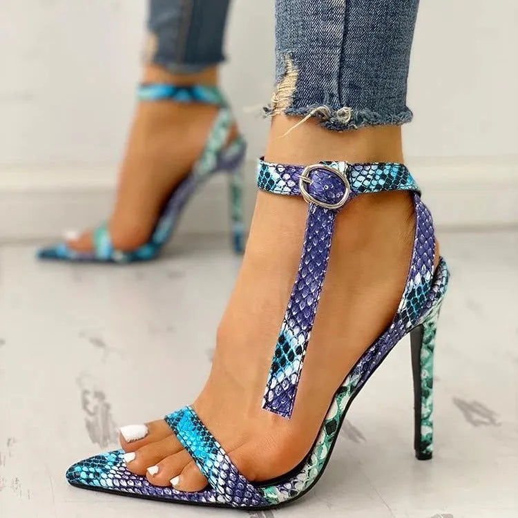 Blue women's high heels with serpentine hollow out design and buckle fastening.