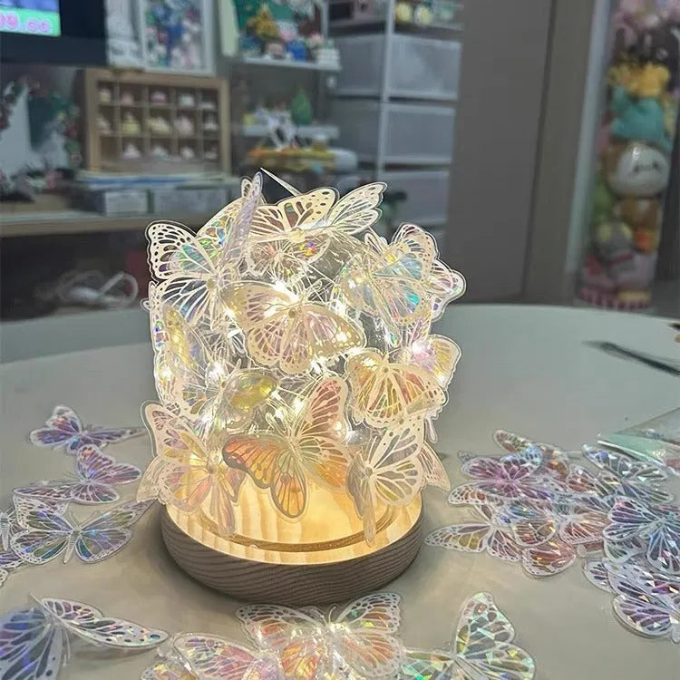 Butterfly night lamp with glass shade on raw wood base, showing 12x15cm size.