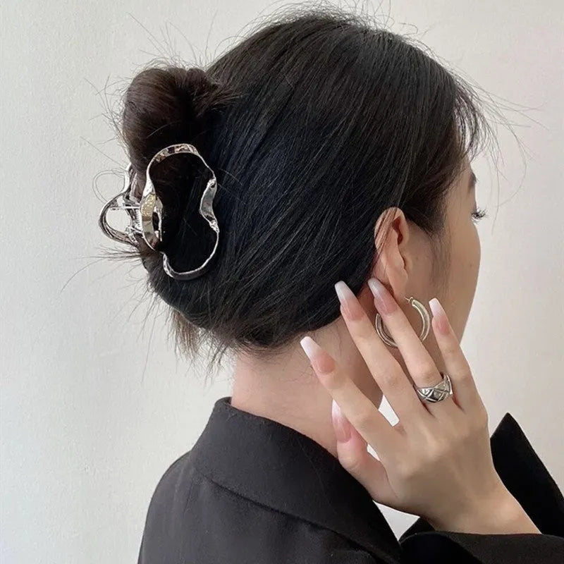 Silver metal hair clips collection with various Korean style designs including bows, pearls, and wave patterns