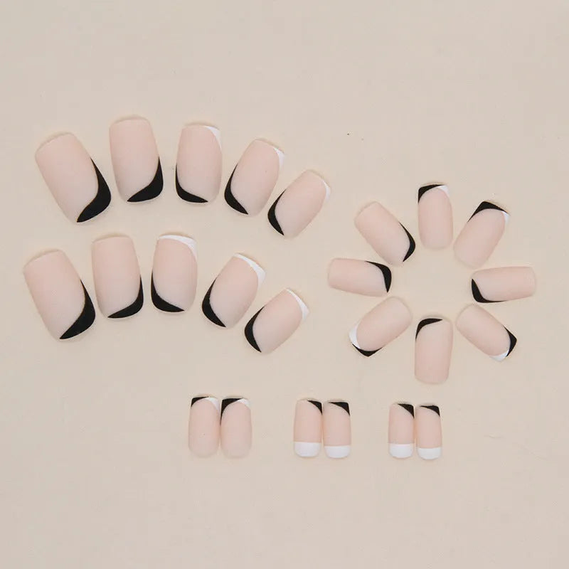 Black and white frosted French manicure artificial nails on display