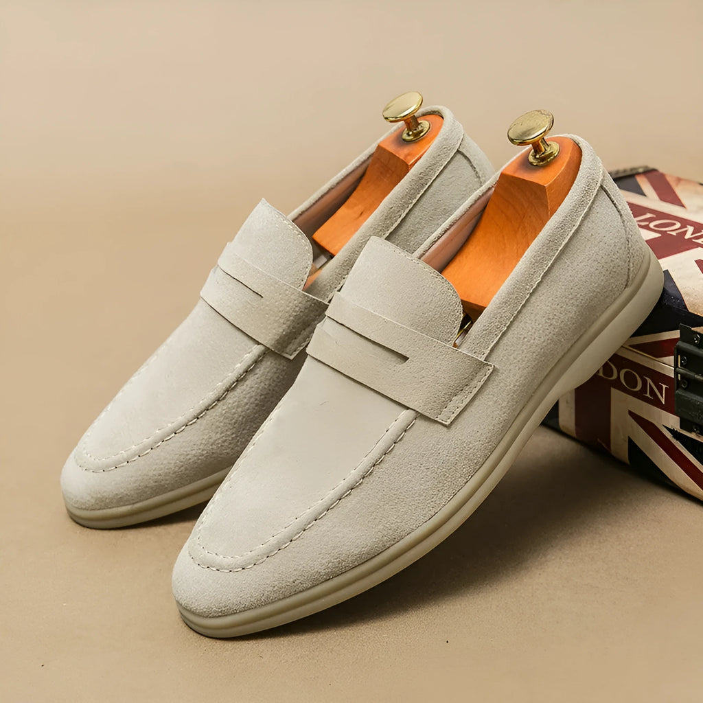 Men's black leather slip-on shoes with round toe and rubber sole on a white background