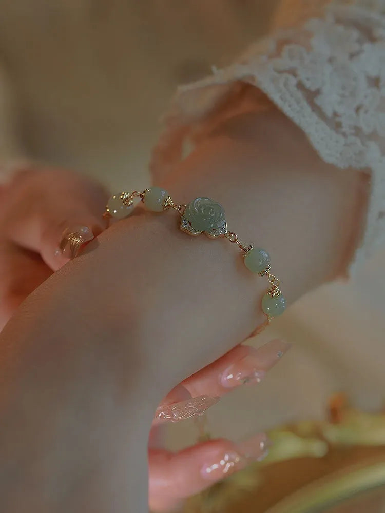 Women's bracelet with Hetian jade rose petals and 14K gold gilding in a floral design.