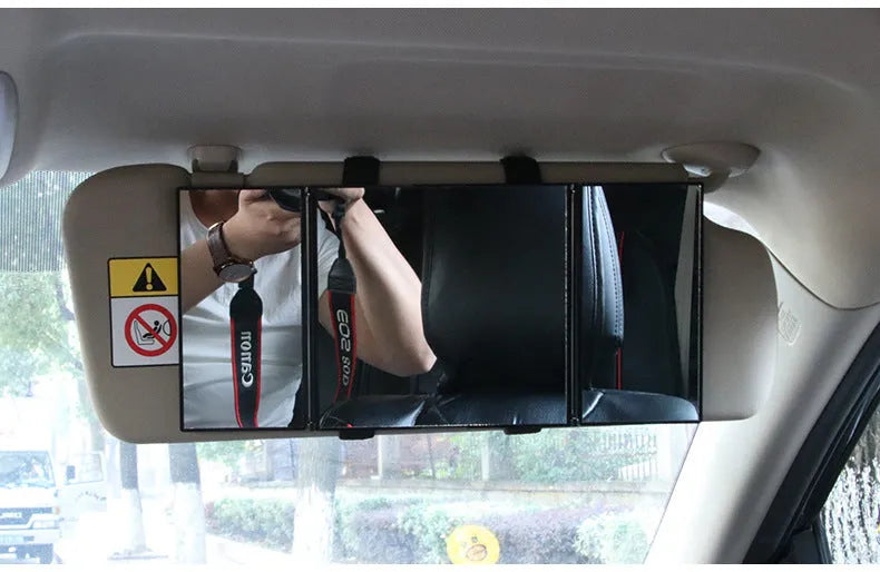 Silver car folding makeup mirror shown open and closed on a car visor