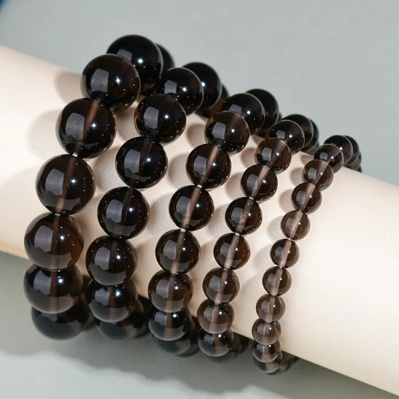 Hand-woven obsidian crystal bracelet couple set showing six colour variations with round beads