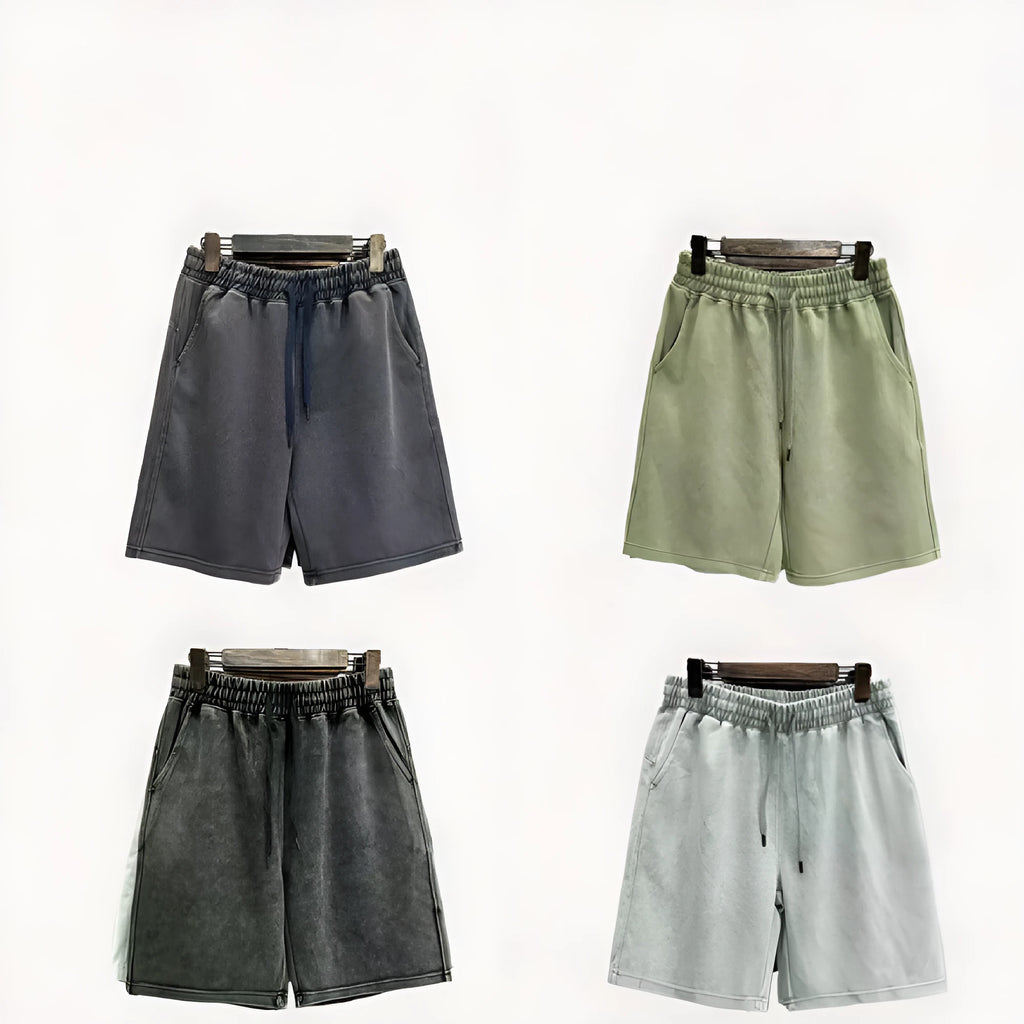 Men's navy blue cotton shorts with a distressed design and loose straight-leg fit on a mannequin.