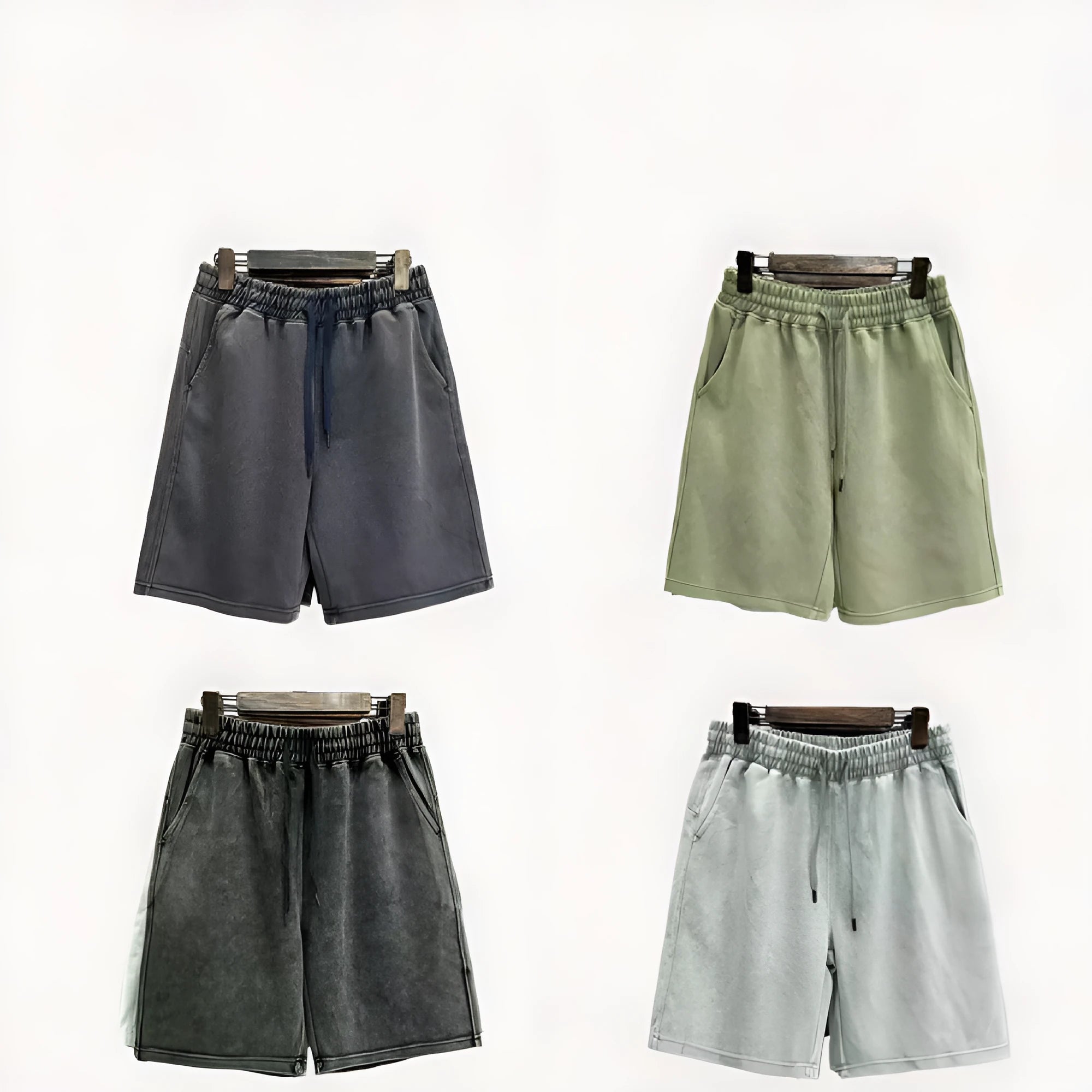 Men's navy blue cotton shorts with a distressed design and loose straight-leg fit on a mannequin.