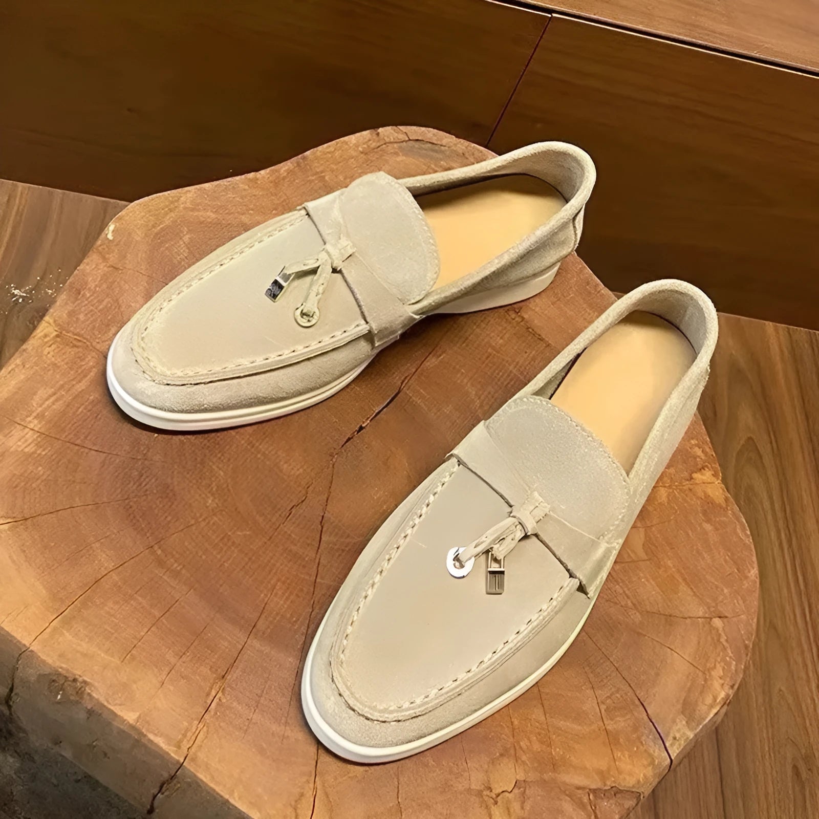 Slip-on high-top loafers in light gray with round toe and rubber sole.