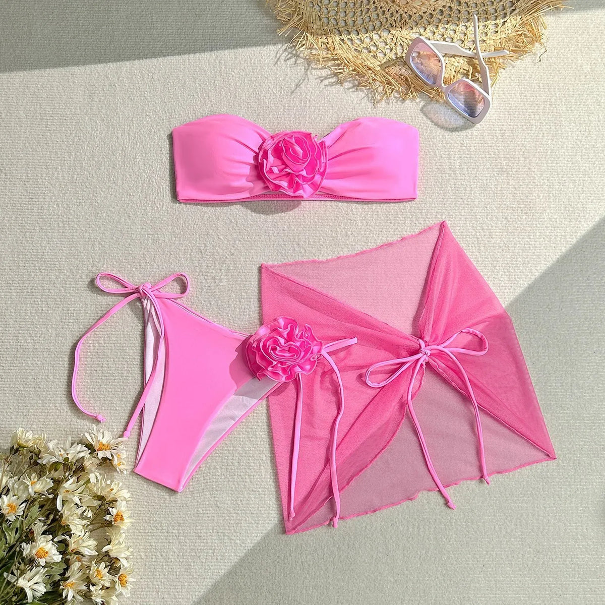 Women's tube top swimsuit with three-dimensional flower tie detail in pink, blue, purple colours