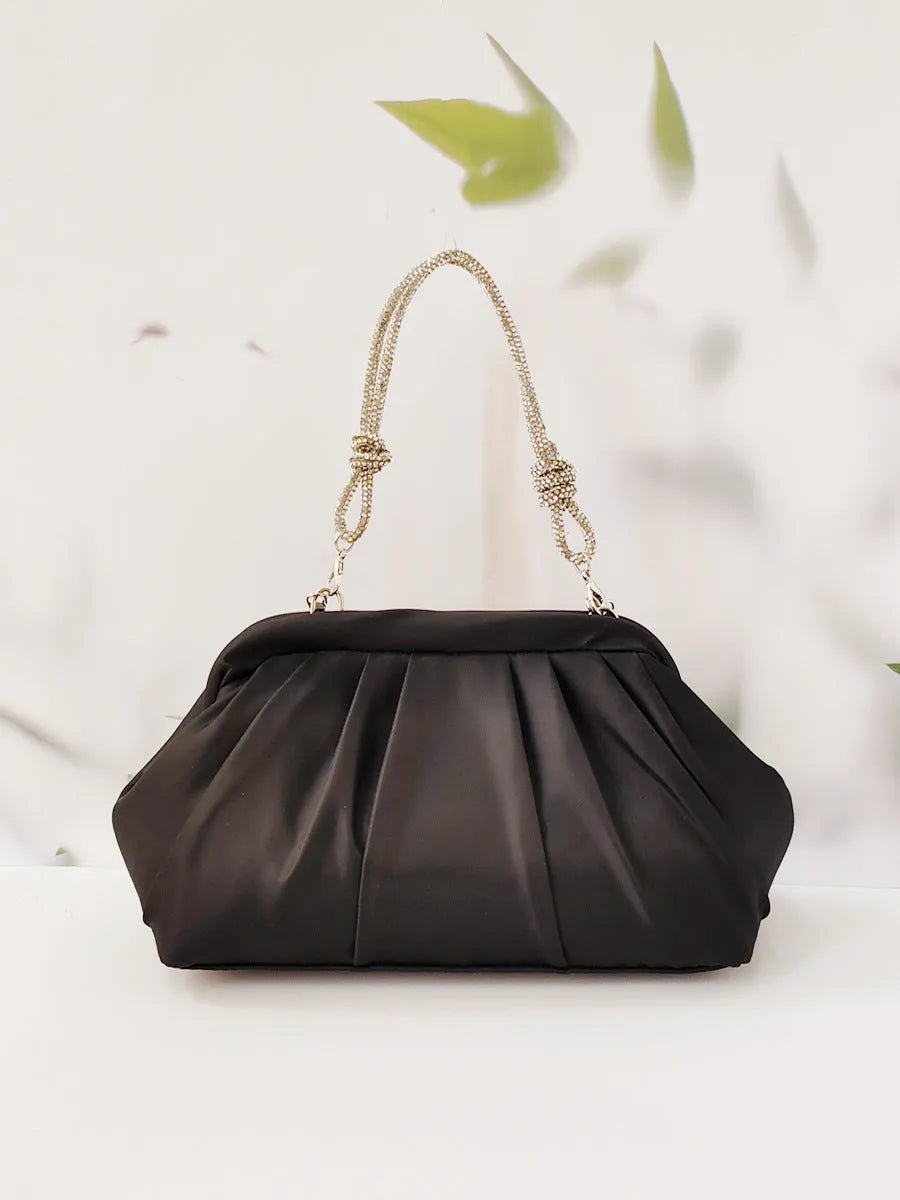 Women's soft polyester messenger bag with chain detailing and diamond pattern in black colour