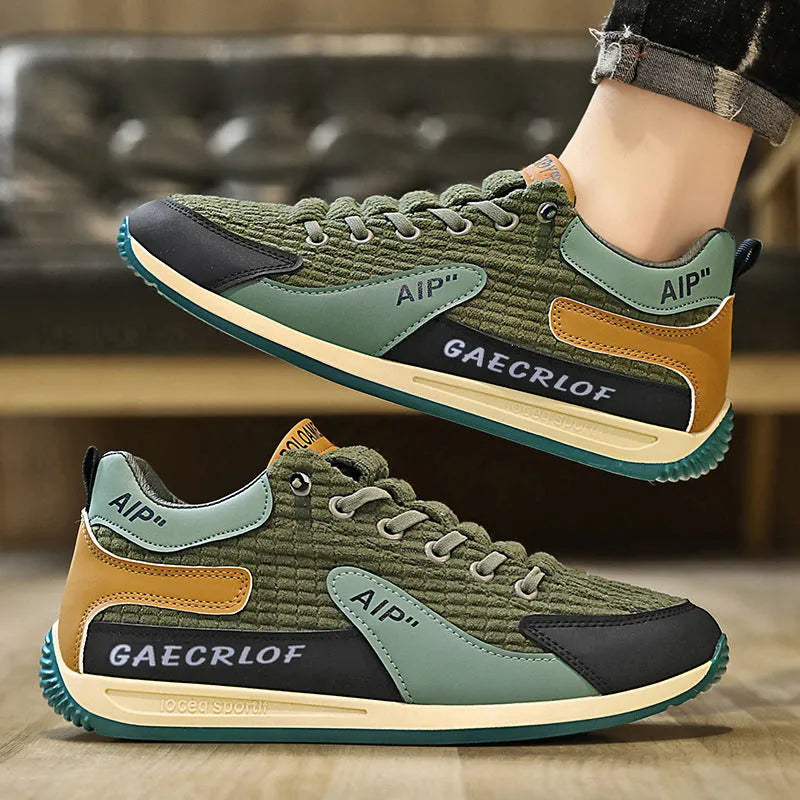 Men's low-top green and grey mesh running shoes with lace-up front.