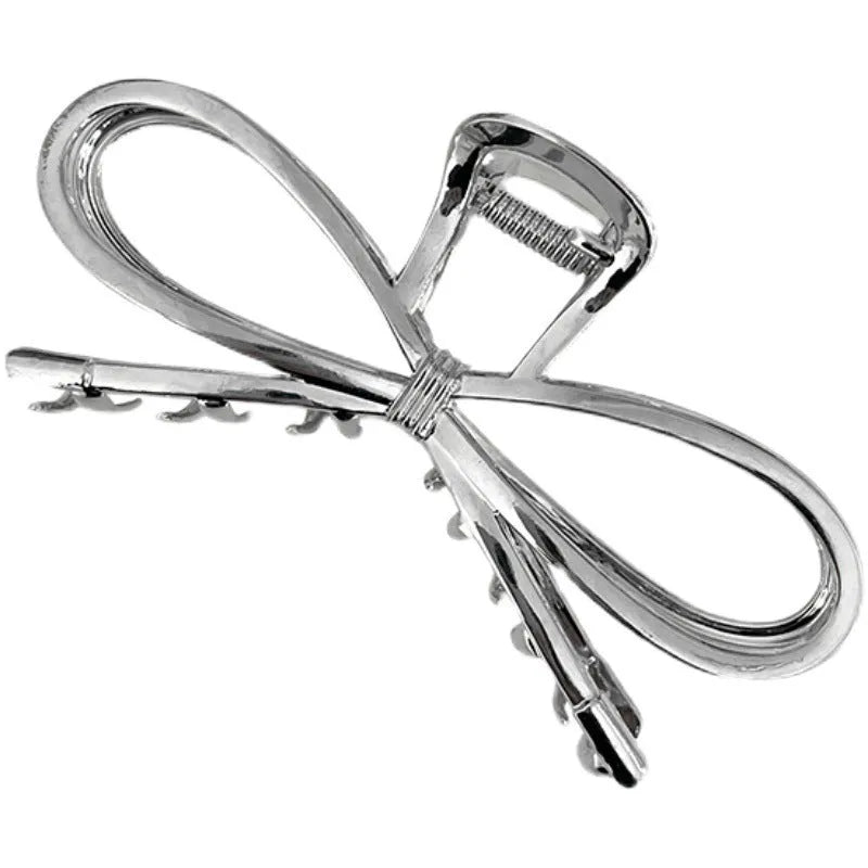 Alloy metal bow hair clip for women in silver or gold colour, Korean style.