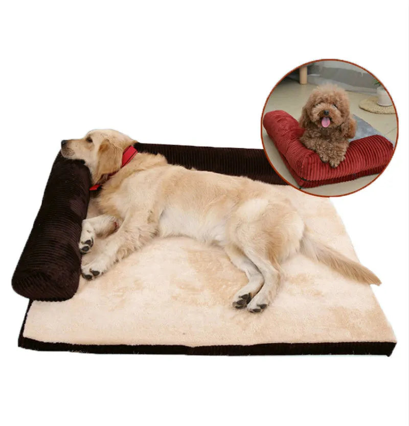 Corduroy pet sofa dog bed with a raised bolster, shown in a grey colour on a wooden floor.