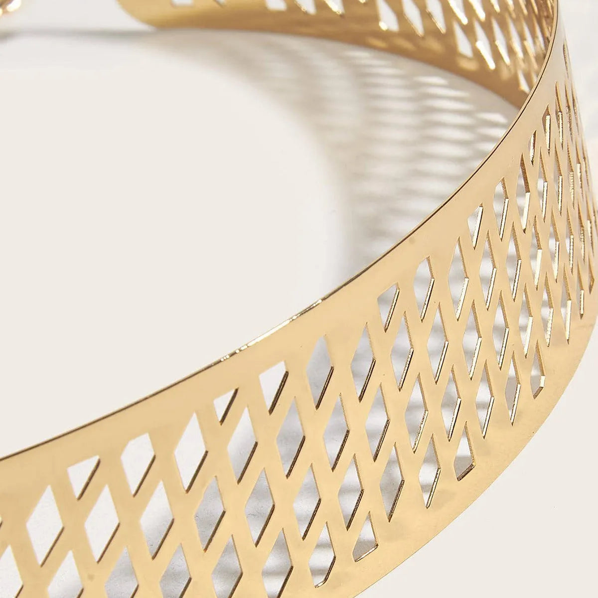 Golden lantern head punching net flower design on a thick black waist seal belt with alloy buckle.