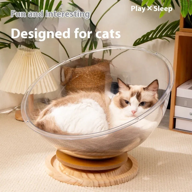 Transparent acrylic cat space capsule bed with turntable base on wooden floor