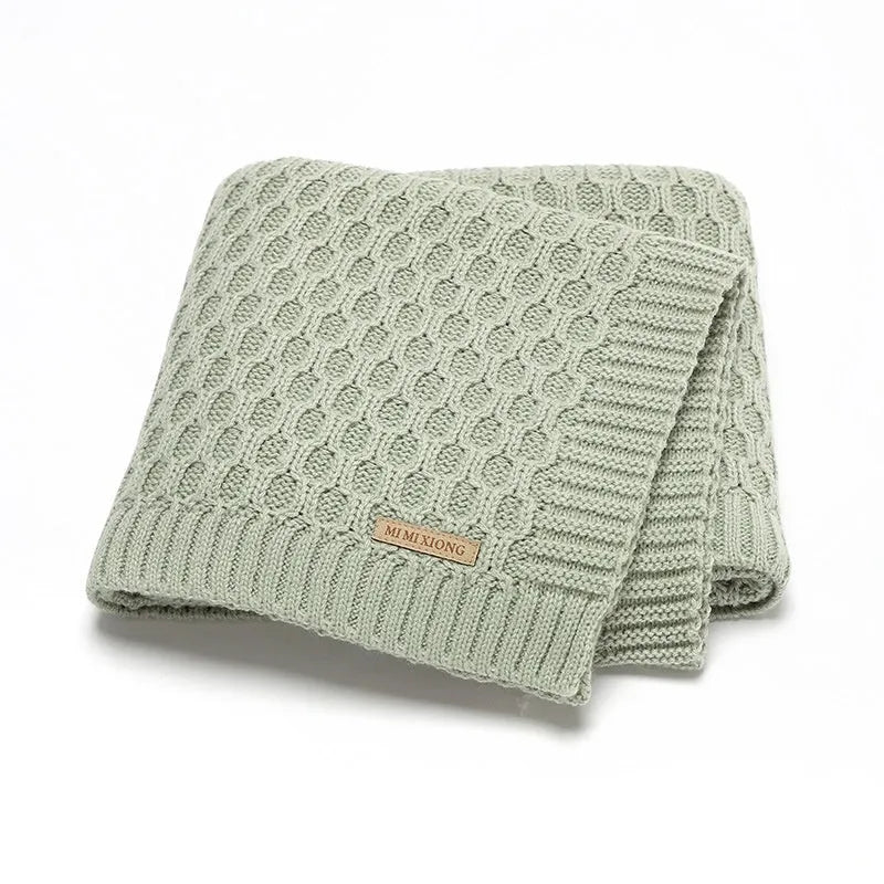 Acrylic infant hug blanket with three-dimensional lines measuring 70×90cm in solid colour options