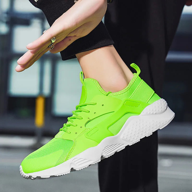 Men's low top casual shoes with mesh upper, cross shoulder straps, and round toe in fluorescent colour options