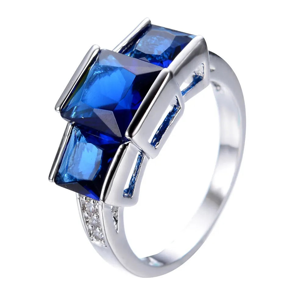 A set of colourful electroplated copper rings for women in sizes 6 to 10, showing apple green, champagne, and sapphire blue colours.