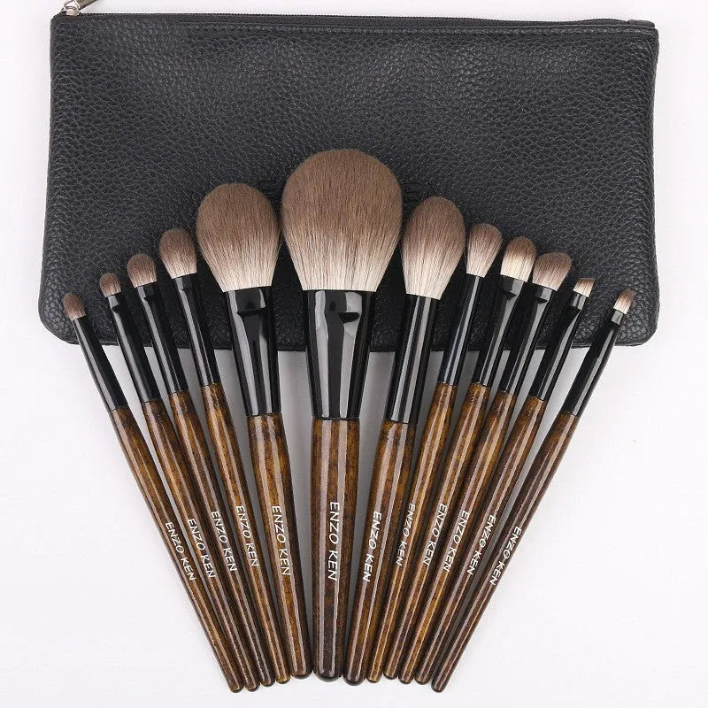A 12-piece makeup brush set with soft bristles and wooden handles in a PU brush bag