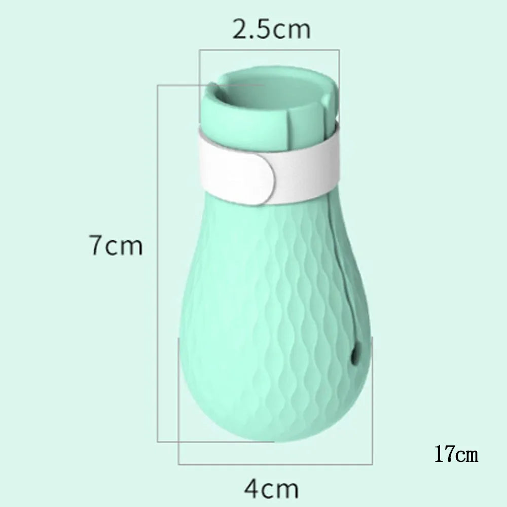 Set of four green silicone cat paw covers used for anti-scratch protection during washing and medicine