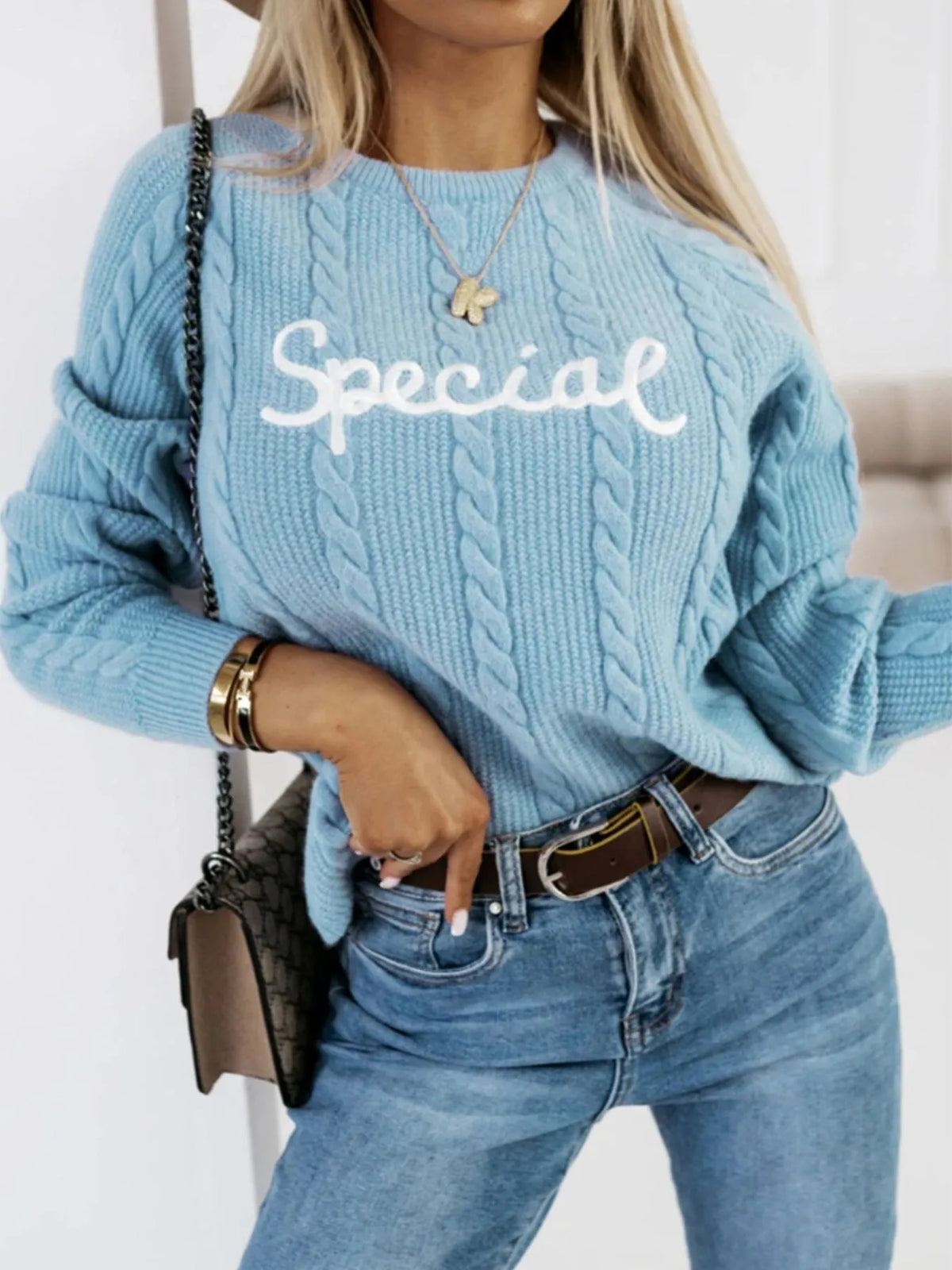 Blue leisure pullover with embroidered letters on crew neck in street fashion style