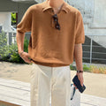 Men's caramel coloured retro asymmetric knitted polo shirt on a hanger, loose fit short sleeve.