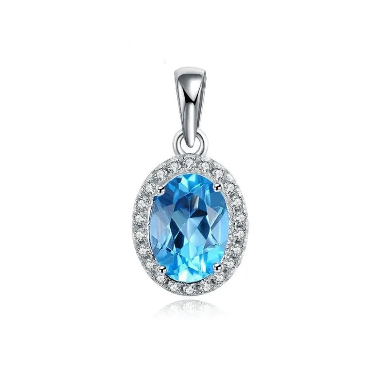 925 sterling silver geometric jewellery set with blue topaz gemstones, showing earrings, ring, pendant, and necklace.