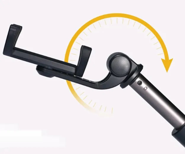 Bluetooth selfie stick tripod with remote control extended with smartphone attached