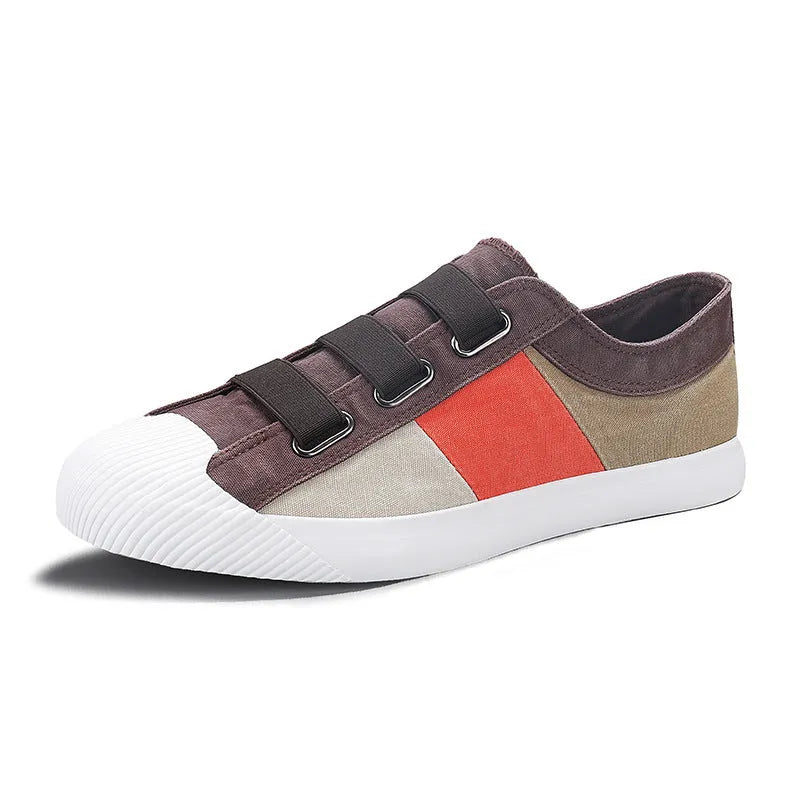 Men's beige canvas low-top sneakers with elastic band closure and a flat rubber sole.