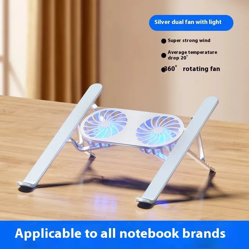 Silver aluminium folding laptop stand with twin cooling fans deployed on a desk.
