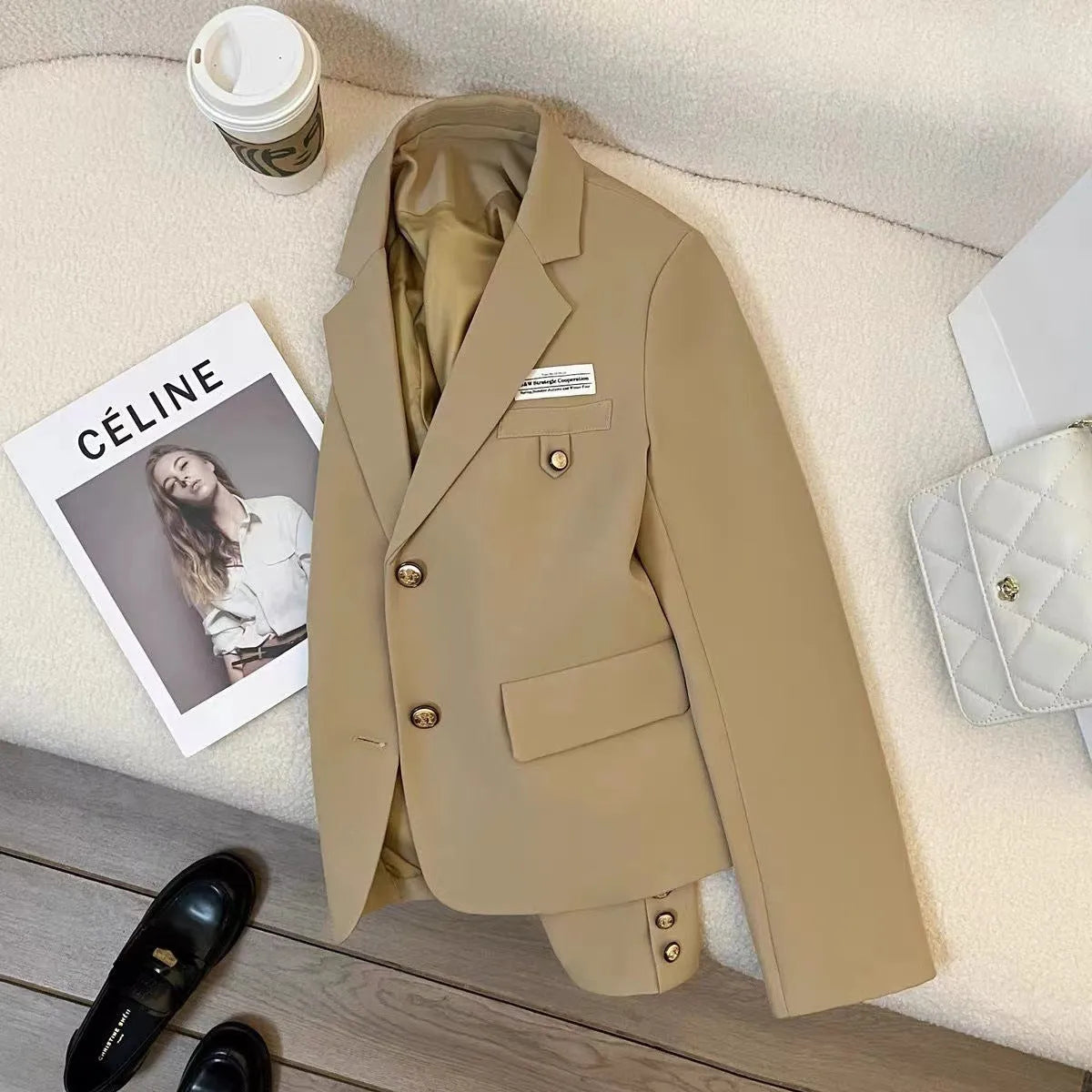 Black women's short suit coat with loose fit design and regular long sleeves