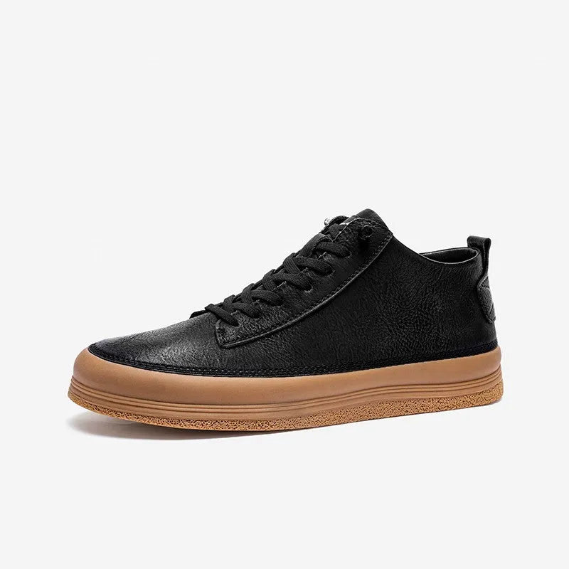 Men's black leather casual shoes with round toe, flat heel, and white rubber sole on a plain background.
