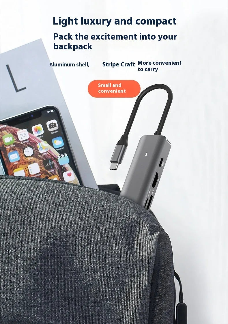 Silver LQT-LH07 7-in-1 USB-C hub and card reader for laptops showing multiple ports.