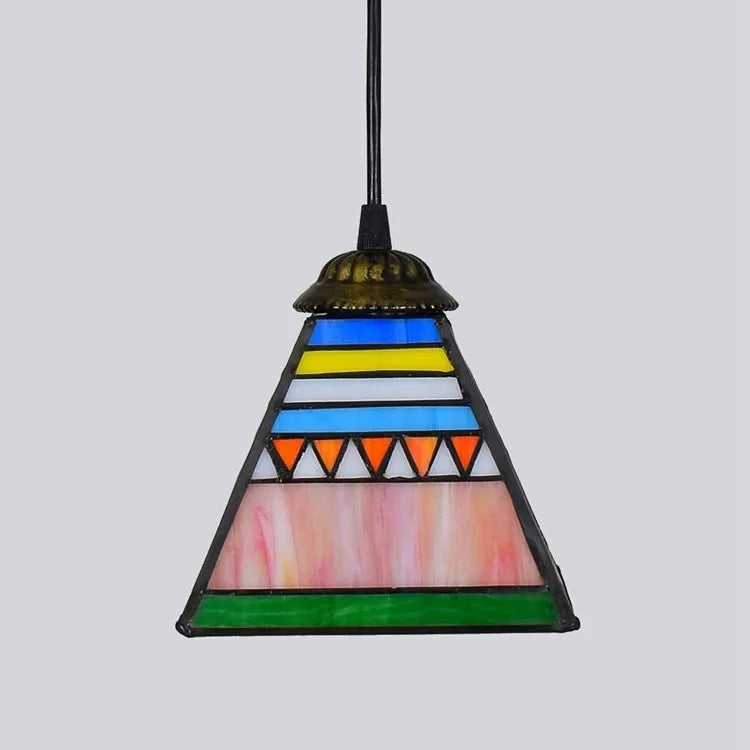 Small art stained glass droplight pendant with coloured glass shade hanging from iron ceiling plate.