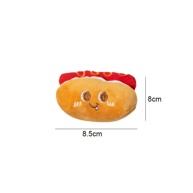 Assortment of kitten teething toys shaped like a hamburger, chicken leg, bread, fries, and hot dog.