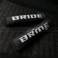 Pair of black car seat belt shoulder pad sleeves with embroidery detail, showing dimensions.