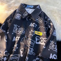 Student loose fit casual shirt with cartoon animation video game graffiti print in white or dark blue, sizes S to 2XL.