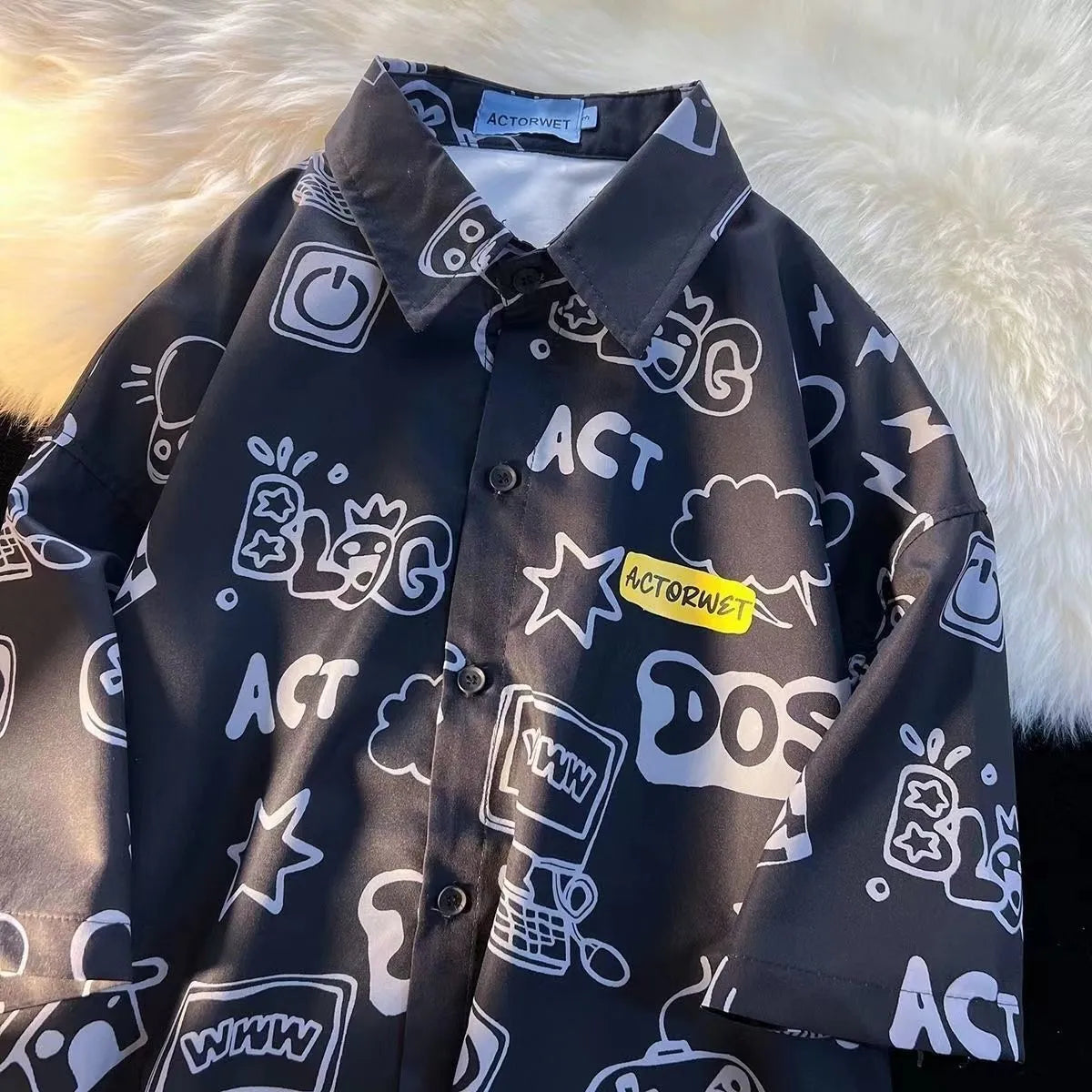 Student loose fit casual shirt with cartoon animation video game graffiti print in white or dark blue, sizes S to 2XL.