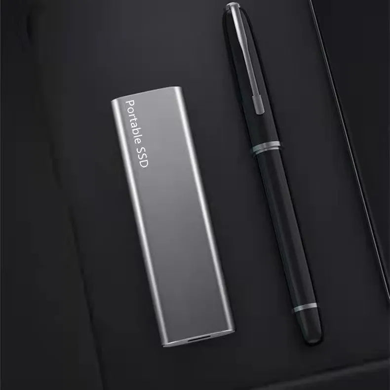 Ultra-thin metal external mobile SSD in red, black, blue, or silver colour options on a plain background.