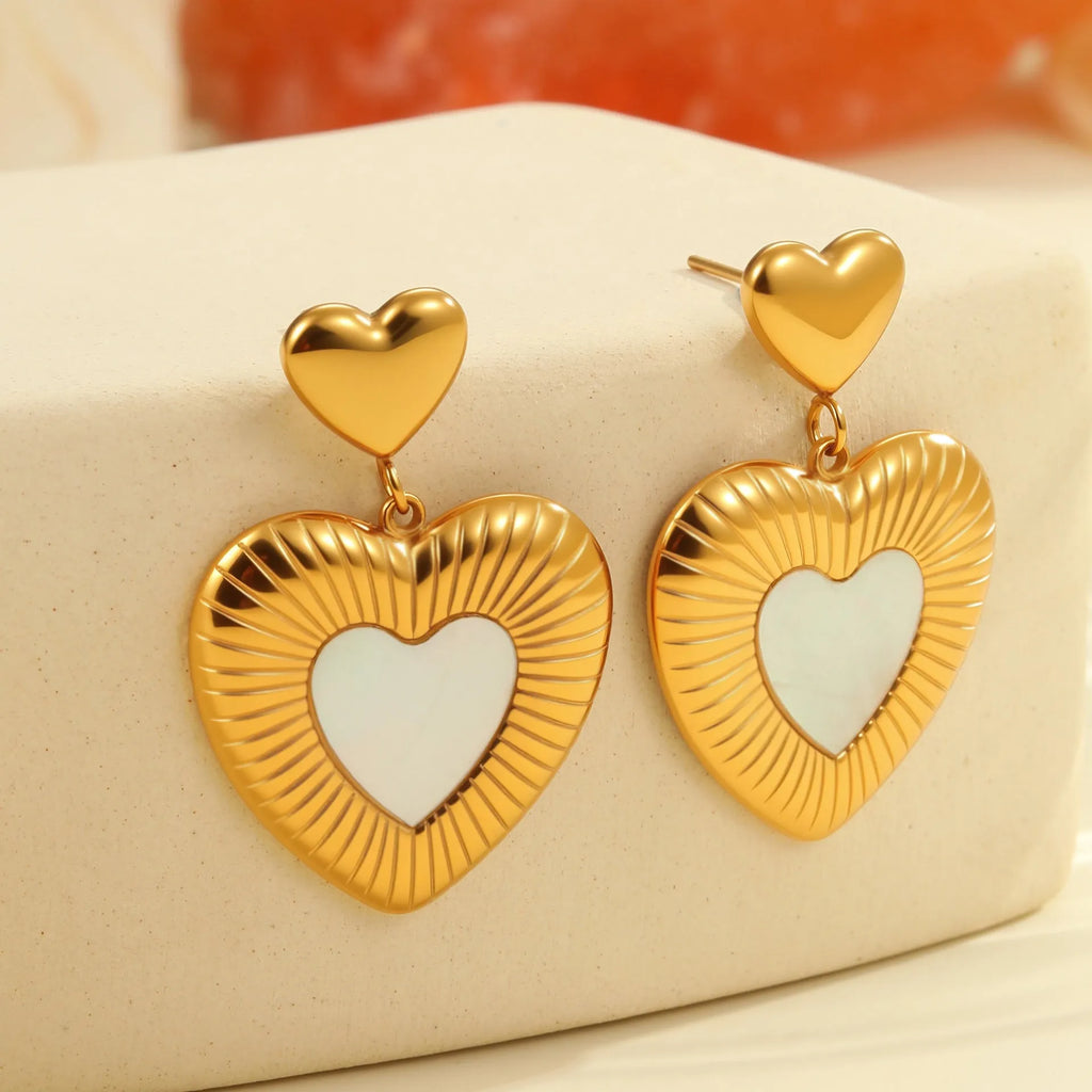 Stainless steel heart-shaped earrings with white fritillary design and 18K gold electroplating finish