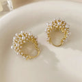Gold-coloured women's flower basket earrings with small rice-shaped beads and pearl inlay on copper.